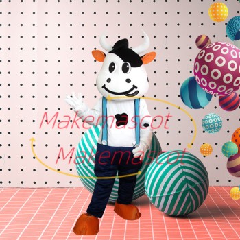 Lively Cartoon Cow In Suspenders Mascot Costume